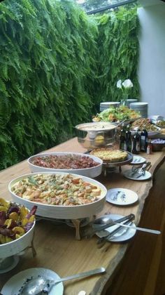 a buffet table filled with different types of food and drinks on it's sides