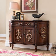 an ornately decorated sideboard in a living room