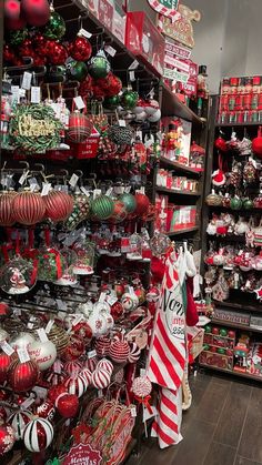 a store filled with lots of christmas ornaments