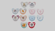 baby bibs with different designs and colors on the front, including winnie the pooh