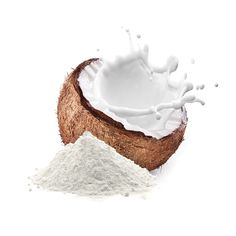 a coconut with milk splashing out of it