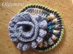 a crocheted flower on top of a table