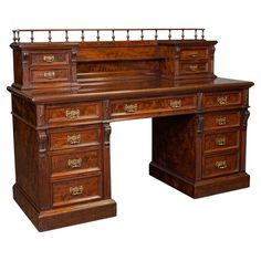 an antique wooden desk with two drawers