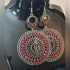 Boho Chic Silver Toned And Red Gem Earings Red Round Jewelry, Red Round Metal Earrings, Red Metal Drop Earrings, Bohemian Red Earrings, Nickel-free Red Earrings For Party, Bohemian Red Metal Jewelry, Red Metal Jewelry For Festival, Red Festival Earrings, Red Alloy Jewelry For Party