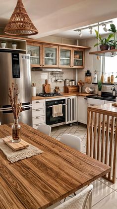 a kitchen filled with lots of wooden furniture and decor on top of tile flooring