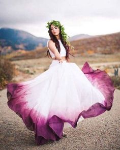 a woman in a white and purple dress