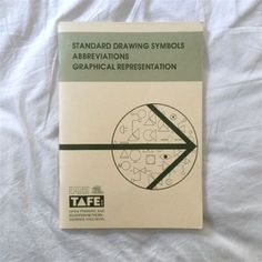 a book about drawing symbols on a white sheet with the title, standard drawing symbols abreavations graphical representation