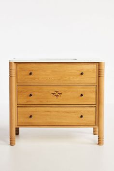 a wooden dresser with two drawers on one side and an open drawer on the other