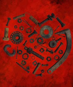 an assortment of tools are arranged in the shape of a heart on a red background