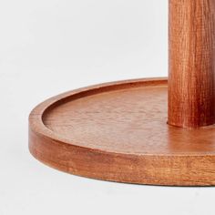 an umbrella stand made out of wood on a white background