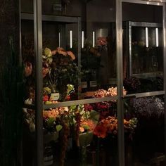 a display case filled with lots of different types of flowers