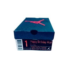 a birthday card in a box with the number one on it