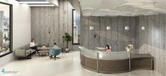 an office lobby with two people sitting at the desk and one person standing in front of the counter