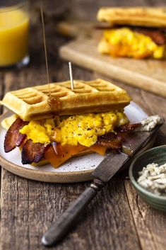 a bacon, egg and cheese waffle sandwich on a plate