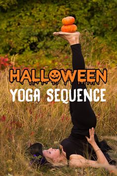 a woman laying in the grass holding up two oranges on her head with text overlay that reads halloween yoga sequence