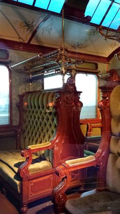 the inside of a train car with chairs and windows