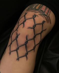 a man's arm with barbed wire on it