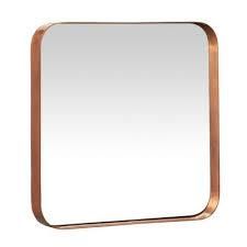 a square mirror with a copper frame on a white background and an empty space for the image