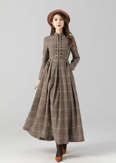 Introducing our plaid ankle-length, long-sleeve wool dress. Whether you're attending a formal event or a casual gathering, this plaid wool dress promises to make a stylish statement while keeping you cozy.  Details: * 35% wool blend, 35% fiber and polyester, 30% nylon * Polyester lining * Two side pockets * Back zipper closure * Long sleeve * Buttons detail on the chest  * Perfect for autumn and winter * Dry clean MODEL SIZE Bust 85 cm(33.4") Waist 67 cm(26.7") Height 168cm (5' 6") She wears siz Long Wool Dress, Winter Wool Dress, Working Dresses, Maxi Dress Winter, Winter Formal Dresses, Cozy Dress, Custom Dress, Dresses Casual Winter, Dress Autumn