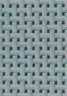 a close up view of a blue and green woven material with small squares on it