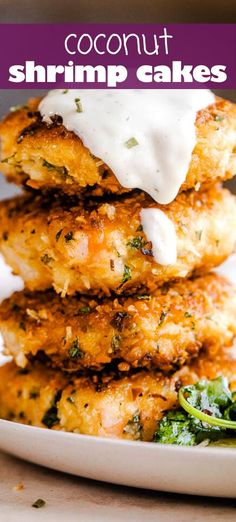 coconut shrimp cakes stacked on top of each other with white sauce and spinach leaves