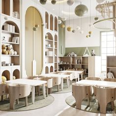 a room with tables, chairs and shelves filled with bookshelves in the background