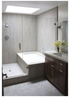 a bathroom with a sink, shower and bathtub