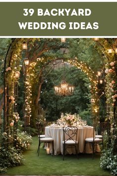 an outdoor dining area with white table cloths and chairs, surrounded by greenery