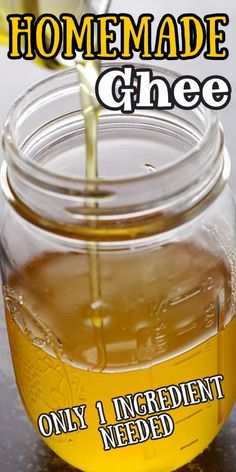 a jar filled with honey sitting on top of a table