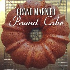 a bundt cake sitting on top of a cooling rack with the words grand marnier pound cake