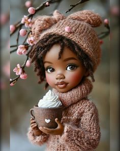 a doll is holding a cup of coffee