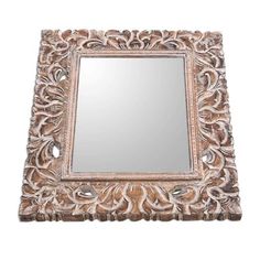 an ornate mirror is shown on a white background and it looks like the frame has been carved