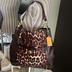 Worn Once For About An Hour. Then It Just Sat In Her Closet. Pristine Condition. Like New, Coach, Leopard Print Canvas & Brown Leather Bag. Smells Brand New (Listed As Nwt So One For New Or Like-New Can Find More Easily). Approx Dimensions 14” X 14” X 4” Handle Drop 10” We Have Over 2500 Five Star Reviews. Please Bundle For Additional Discounts. Bin: Dsbnfgs100-7x,0 Her Closet, Brown Leather Bag, Five Star, Coach Bags, New Color, Leather Bag, Brown Leather, Leopard Print, Like New