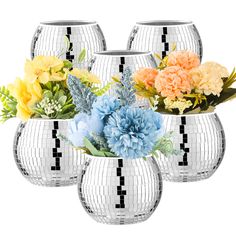 four vases with flowers in them on a white background