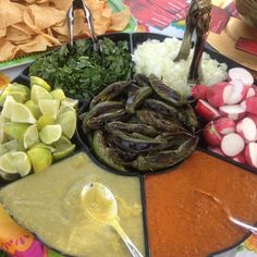 an assortment of vegetables and dips on a plate