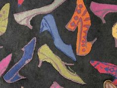 someone's feet are standing on the carpet with colorful shoes drawn on it in different colors