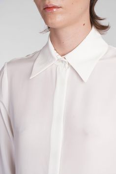 Keltie Shirt in beige silk, collar, long sleeves, hidden closure with buttons, buttons on the wrists, straight hem, semisheer, 100% silk, Made in Lithuania, Model is 180 cm and wears 36 Designer Silk Collared Shirt, White Blouse With Concealed Placket For Office, Luxury White Collared Blouse, White Blouse With Concealed Placket And Fold-down Collar, Chic White Blouse With Concealed Placket, Elegant White Blouse With Concealed Placket, Semi-formal Collared Blouse With Placket, Chic Formal Shirt With Collared Neckline, Timeless Daywear Blouse With Concealed Placket