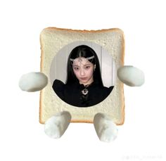 a woman with long black hair is in a slice of bread