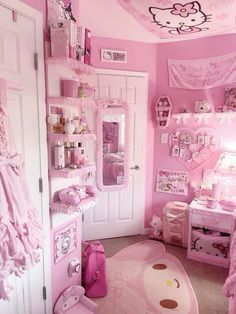 a bedroom decorated in pink with hello kitty decorations