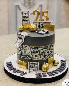 a birthday cake with money and gold decorations on the top is decorated in black and white