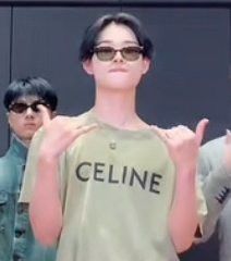 a mannequin with the word celline written on it's chest and two men standing behind him