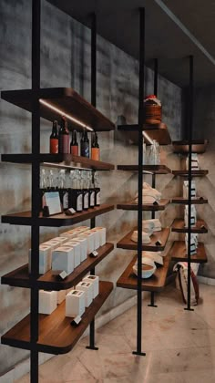 the shelves are filled with wine bottles and boxes