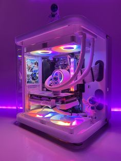 the computer case is lit up with colorful lights and features an array of parts in it