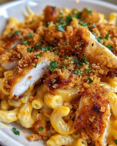 pasta with chicken and parmesan cheese in a white bowl