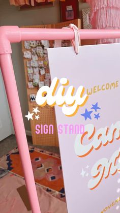 a sign that says diy welcome to the eastside arts festival on it's pink frame