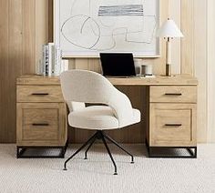 a white chair sitting in front of a wooden desk