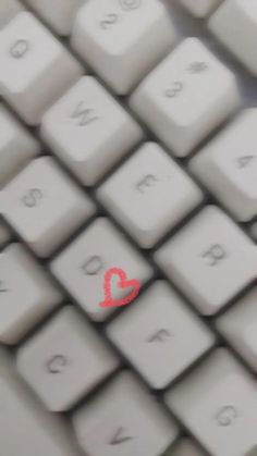 a close up view of a computer keyboard with the word love painted on it