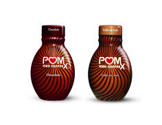 two bottles of pom ketchup coffee with chocolate on the top and bottom