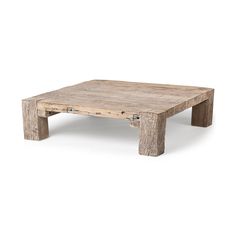 a wooden coffee table sitting on top of a white floor