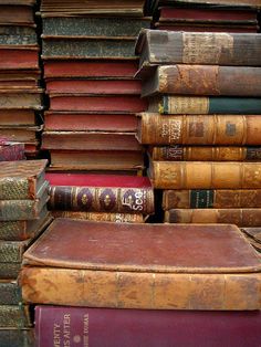 a stack of old books sitting on top of each other